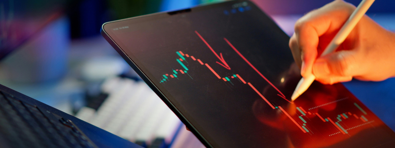 Chart analysis on tablet. Photography by Jakub Żerdzicki via Unsplash